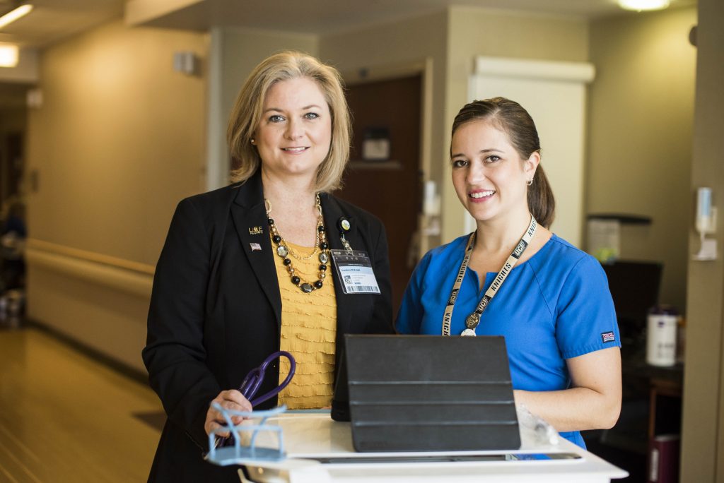 two nurses smiling