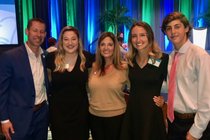 Adam Goldstein with his family and UCF nursing alumna Haley, RN