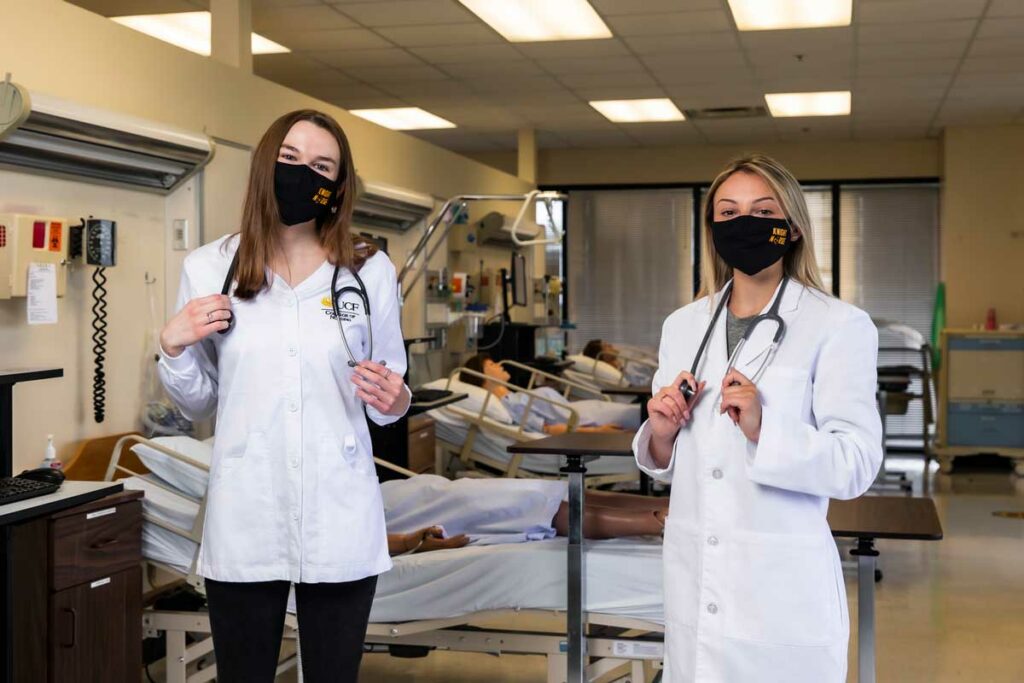 UCF nursing undergraduate students in lab with face masks