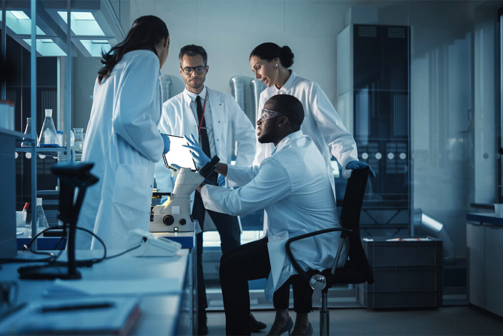 Photo of scientists and researchers working together in a lab.