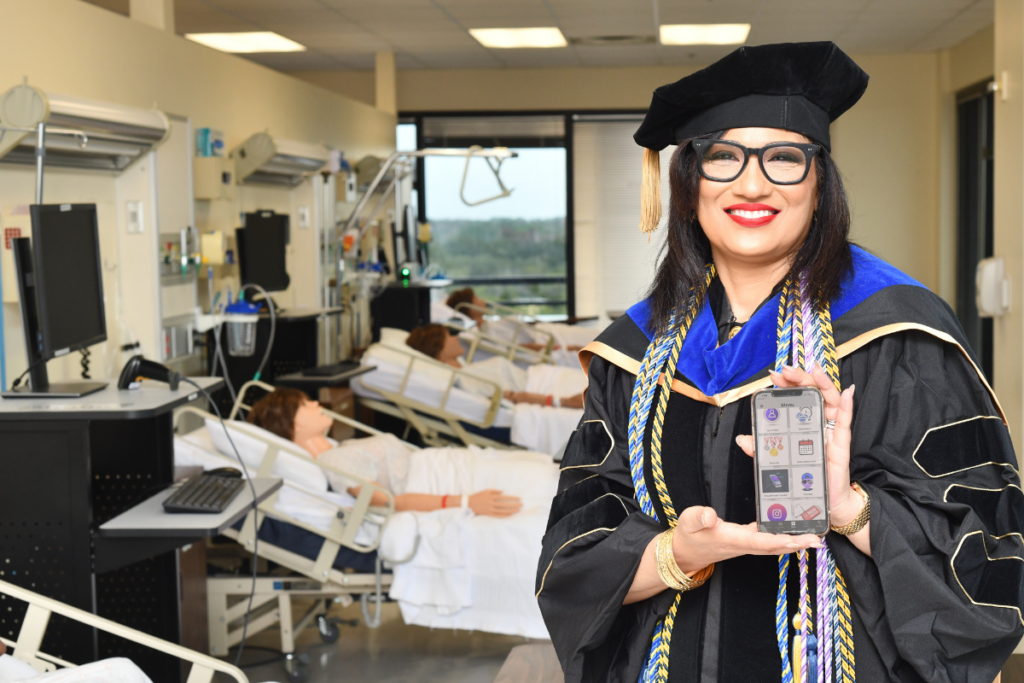 Michelle Tall, UCF Nursing PhD graduate, with Medilepsy - an app she developed and tested to help adolescents with epilepsy self-manage the chronic condition.