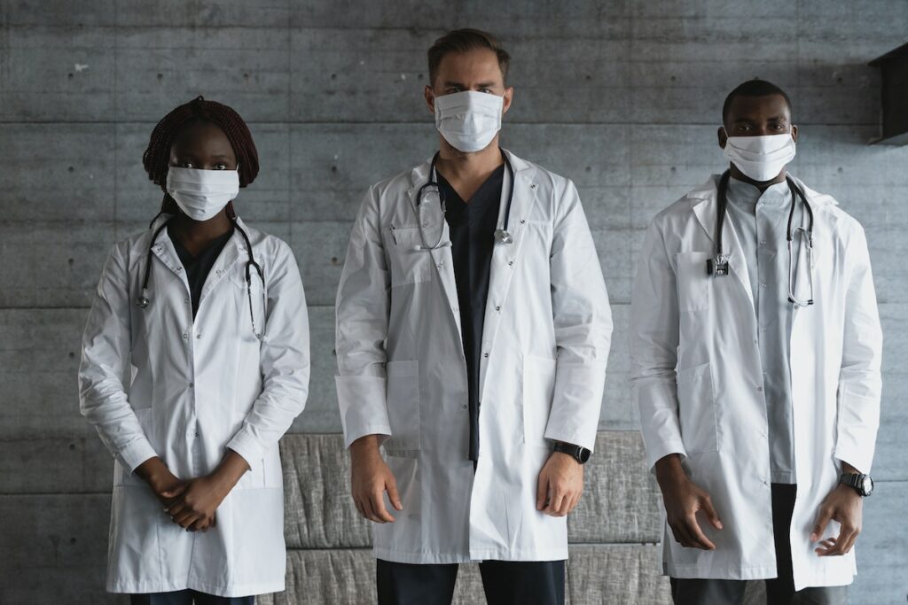 Healthcare workers wearing face masks (stock photo)