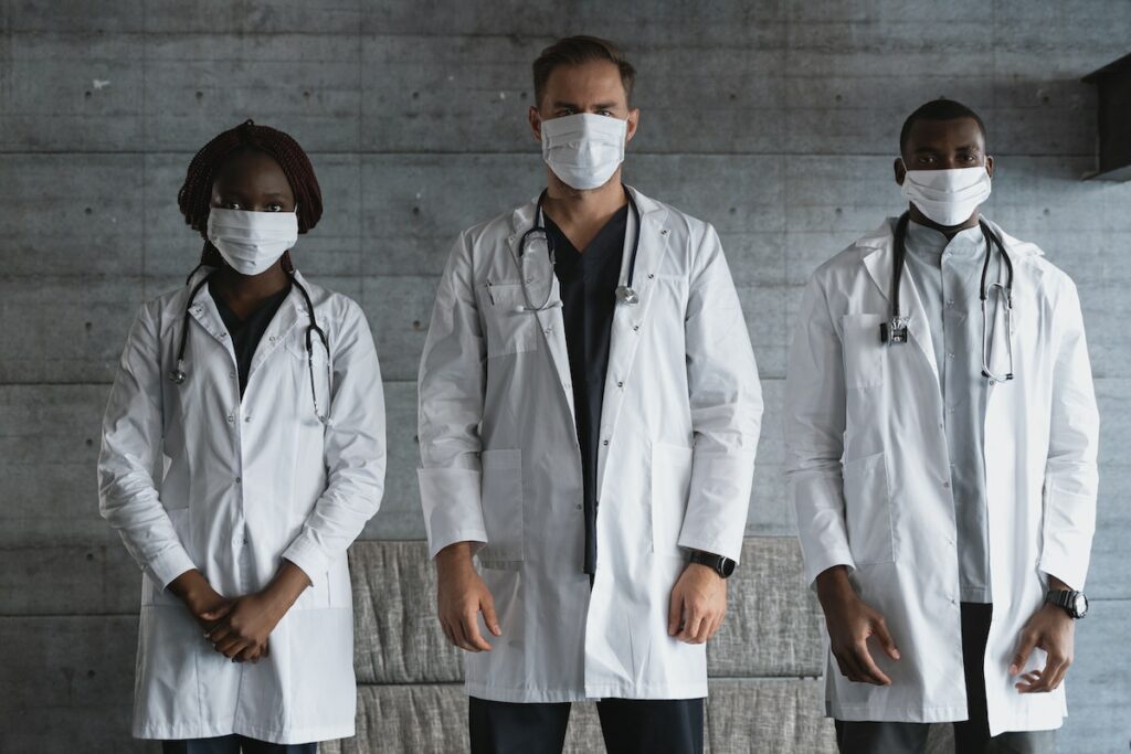 Healthcare workers wearing face masks (Stock Photo)