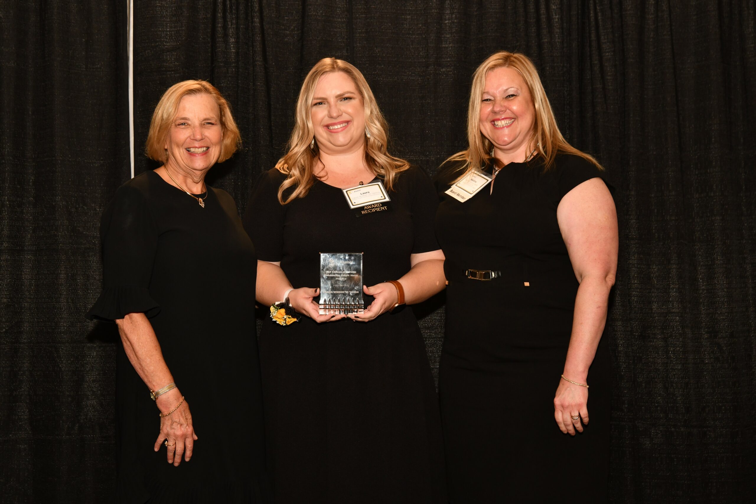 Laura Wieber, Outstanding Knight Nurse Awardee with Dean Mary Lou Sole and Alumni Chapter Recognition Chair Nadine Garcia