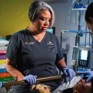 Desiree Diaz UCF College of Nursing Healthcare Simulation Expert in the STIM Center with a student