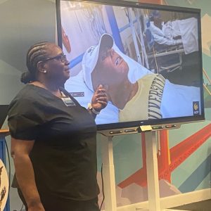 UCF healthcare simulation graduate student Vandolyn Mcintosh presents to University of The Bahamas faculty.