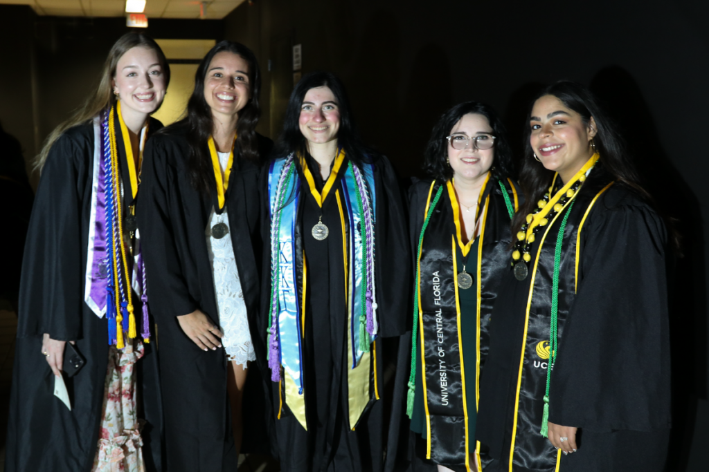 A group of graduating UCF nursing students backstage at the Summer 2023 recognition ceremony at The Venue
