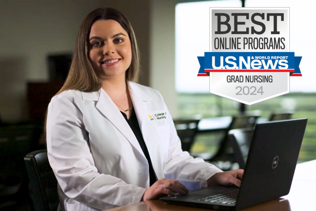 A UCF College of Nursing student sits at a desk typing on a laptop. U.S. News & World Report Best Online Programs badge for Grad Nursing 2024.