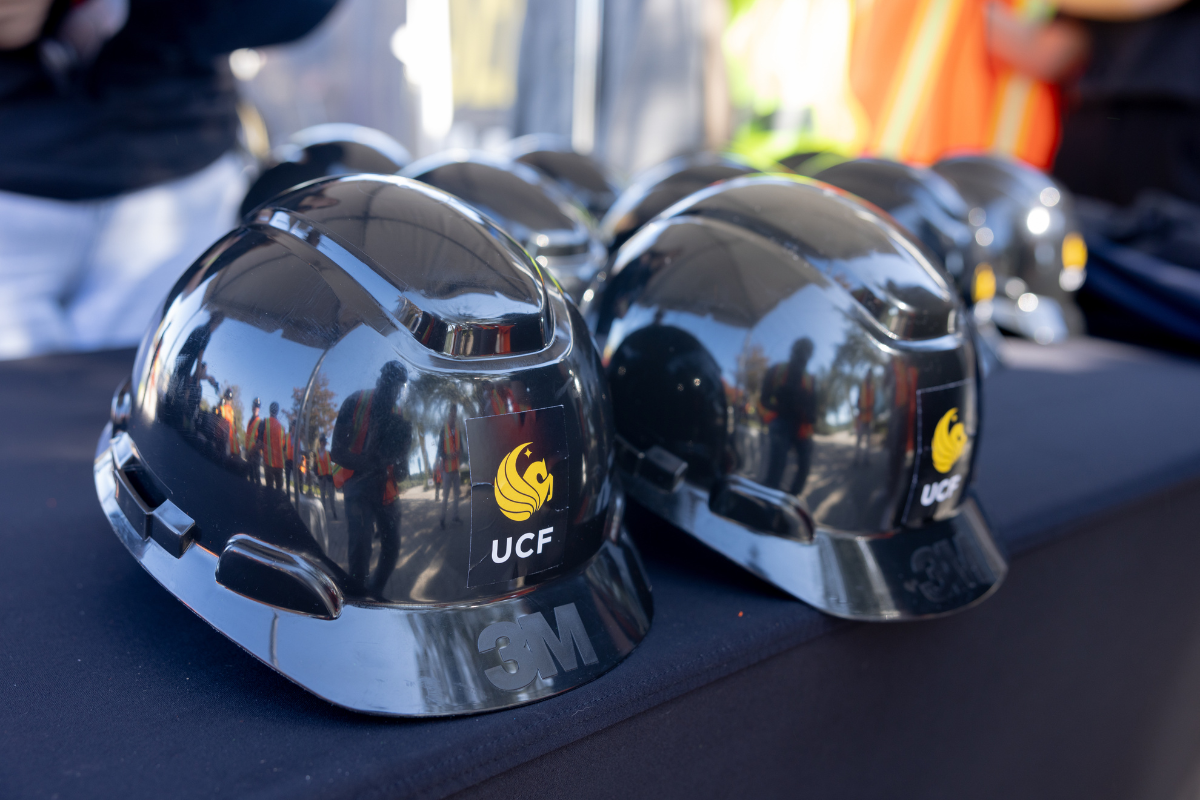 UCF hard hats sit on a table