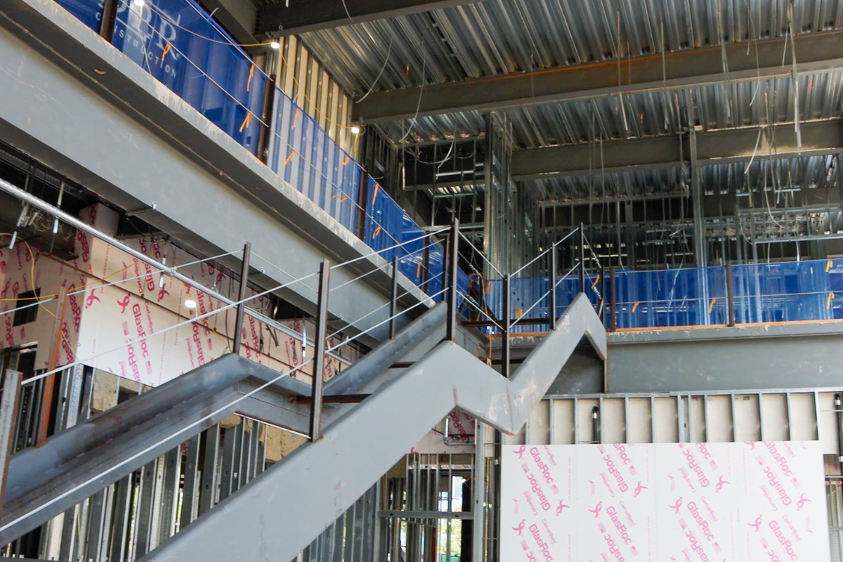 Inside the future Dr. Phillips Nursing Pavilion, construction view from the lobby looking up at the open staircase