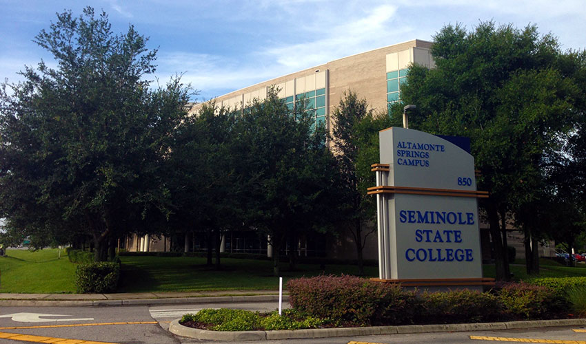 Exterior of a building and road sign for Seminole State College and UCF Connect Altamonte Springs Center