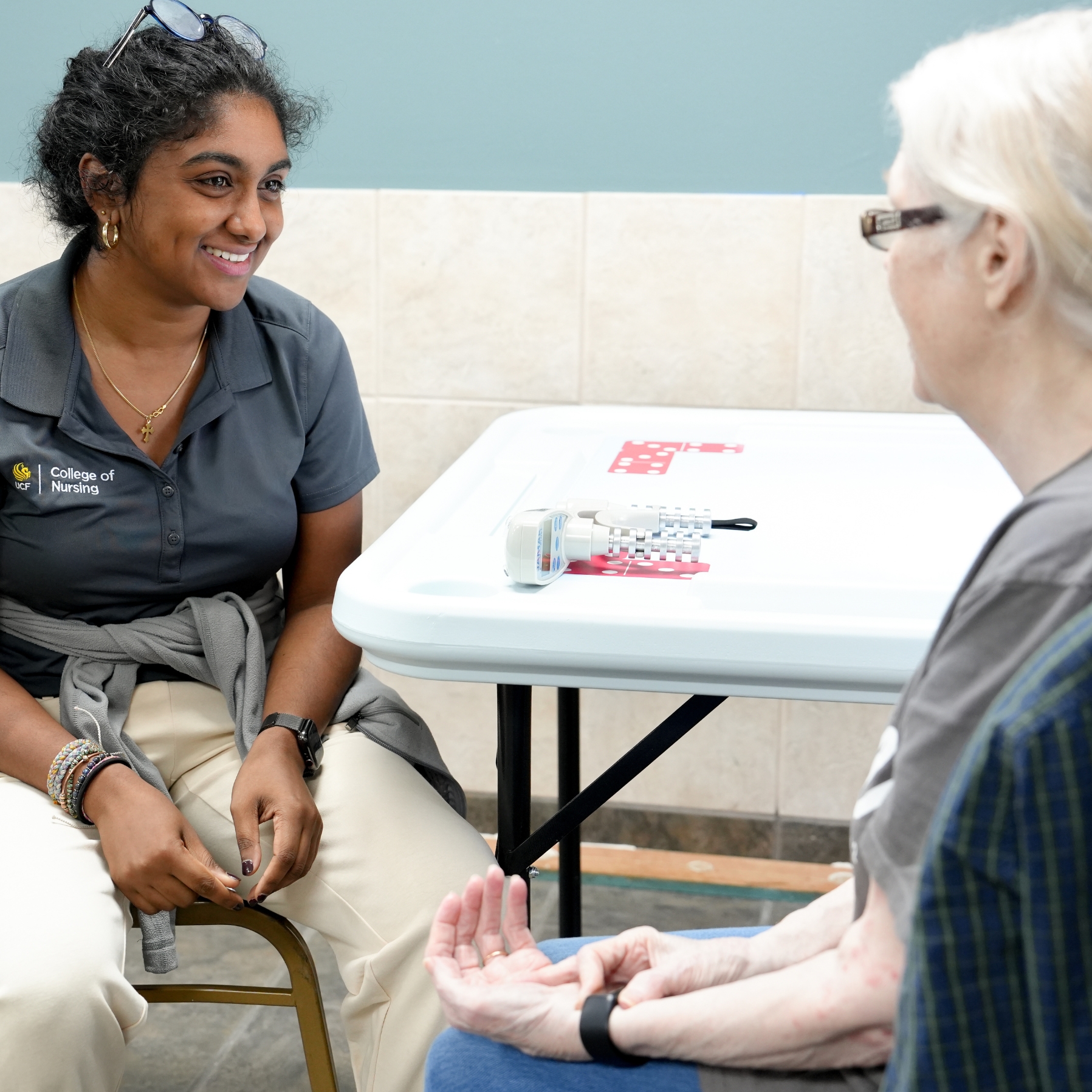 Two people conversing with one another.