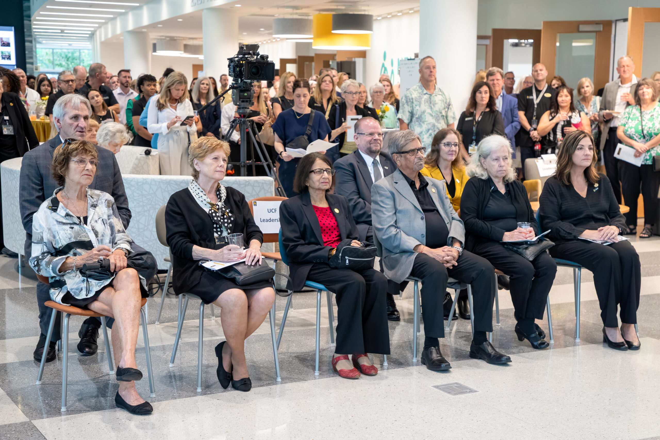 Guests and founding donors Dr. Zaby Vyas and Suree Vyas listening to open remarks within the Zaby and Suree Vyas Collaboration Concourse.